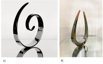 A) Curl B) Tarana (set of 2, both kinetic sculptures) | A) 7.5 in. diameter B) 8 x 4.75 in.